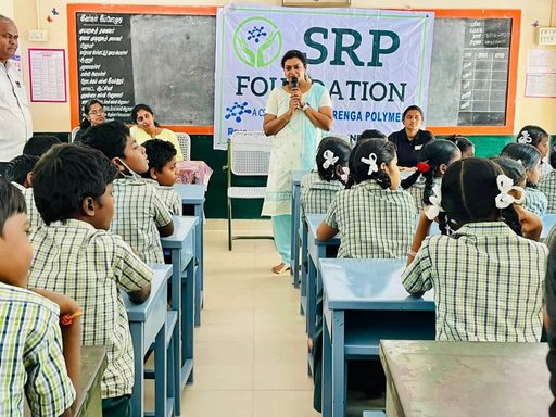 Schoolchildren listen during an SRP Foundation health and wellness awareness session.